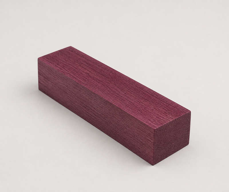 Angled view of a short Purpleheart wood block highlighting its dense grain and vivid purple color for cue building