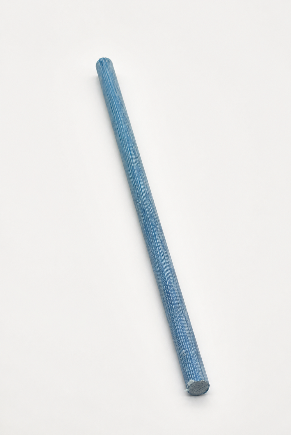 Blue canvas phenolic rod on white background